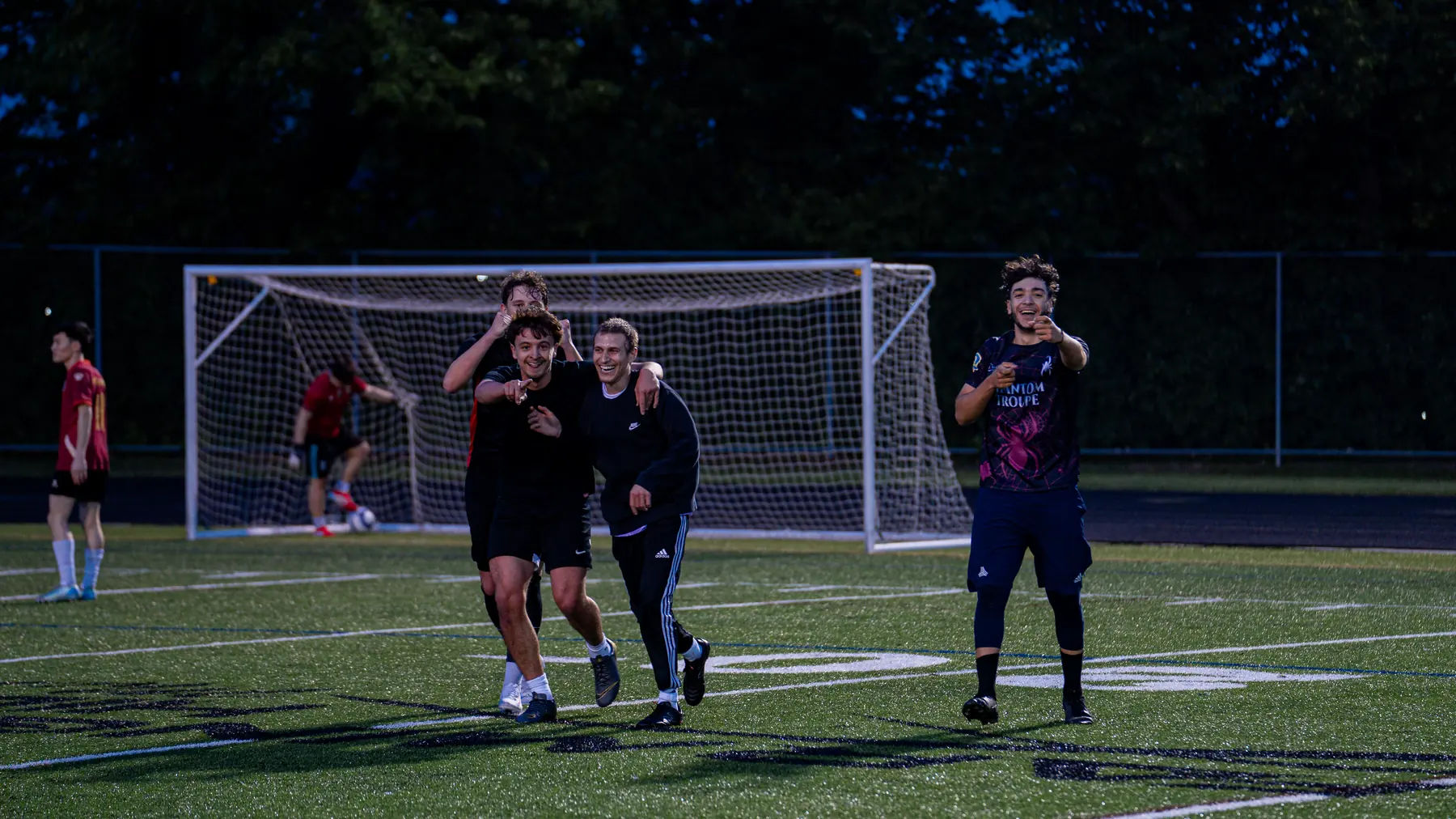 Players celebrating together after a GoodRec pickup soccer game