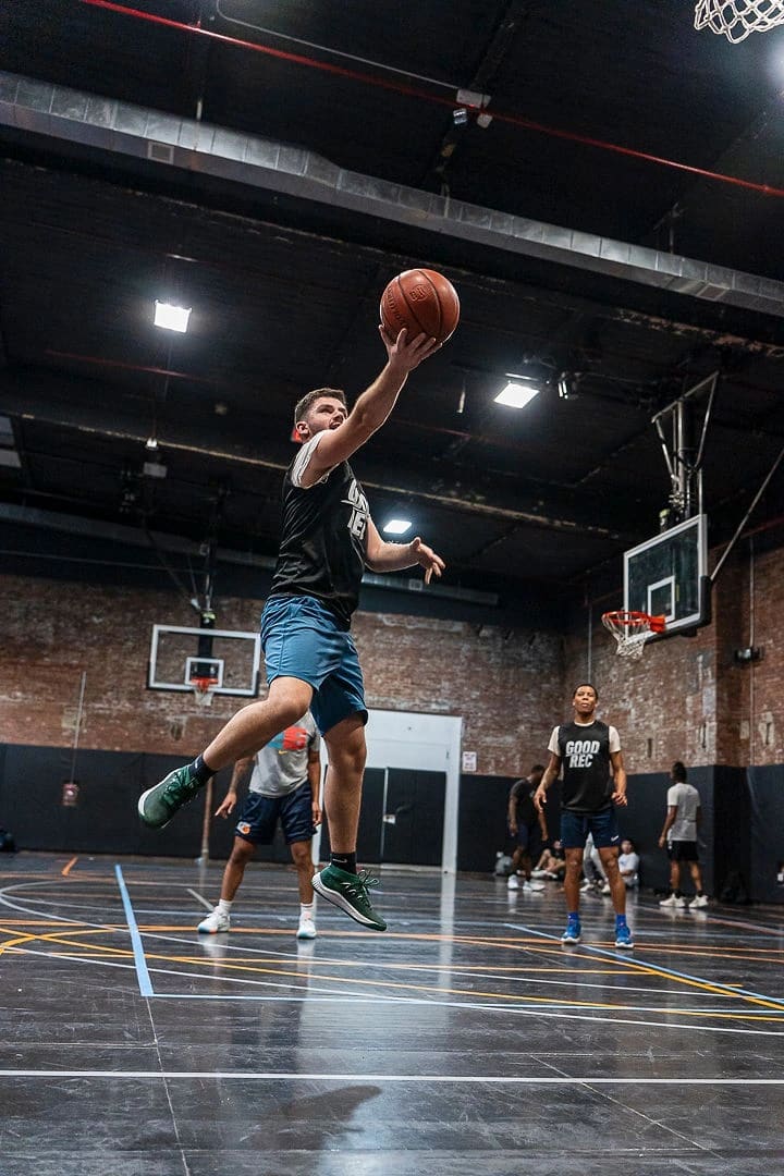 Basketball players competing in a GoodRec pickup game at The Post in Brooklyn
